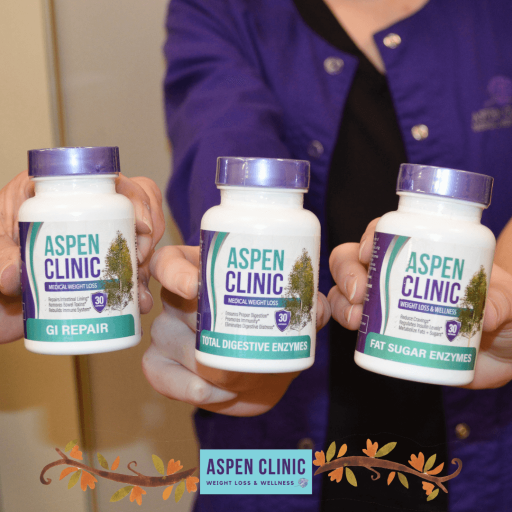 Hands holding a bottle of (from left to right) GI Repair, Total Digestive Enzymes, and Fat Sugar Enzymes