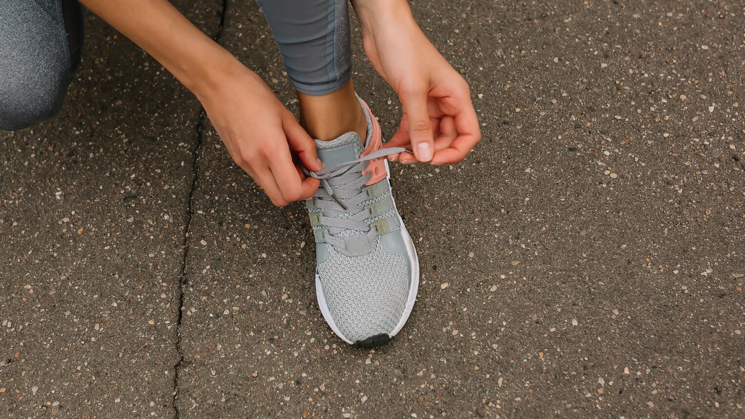 Person Tying Running Shoes